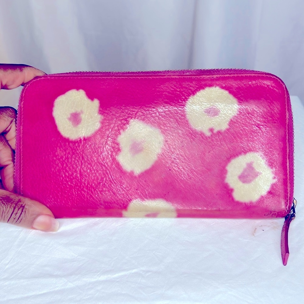ANTHROPOLOGIE pink cloud printed leather zip around wallet.